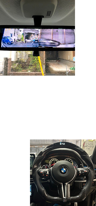 デジタルルームミラーとカーボン調のカスタムステアリングを備えた車内装備のイメージ